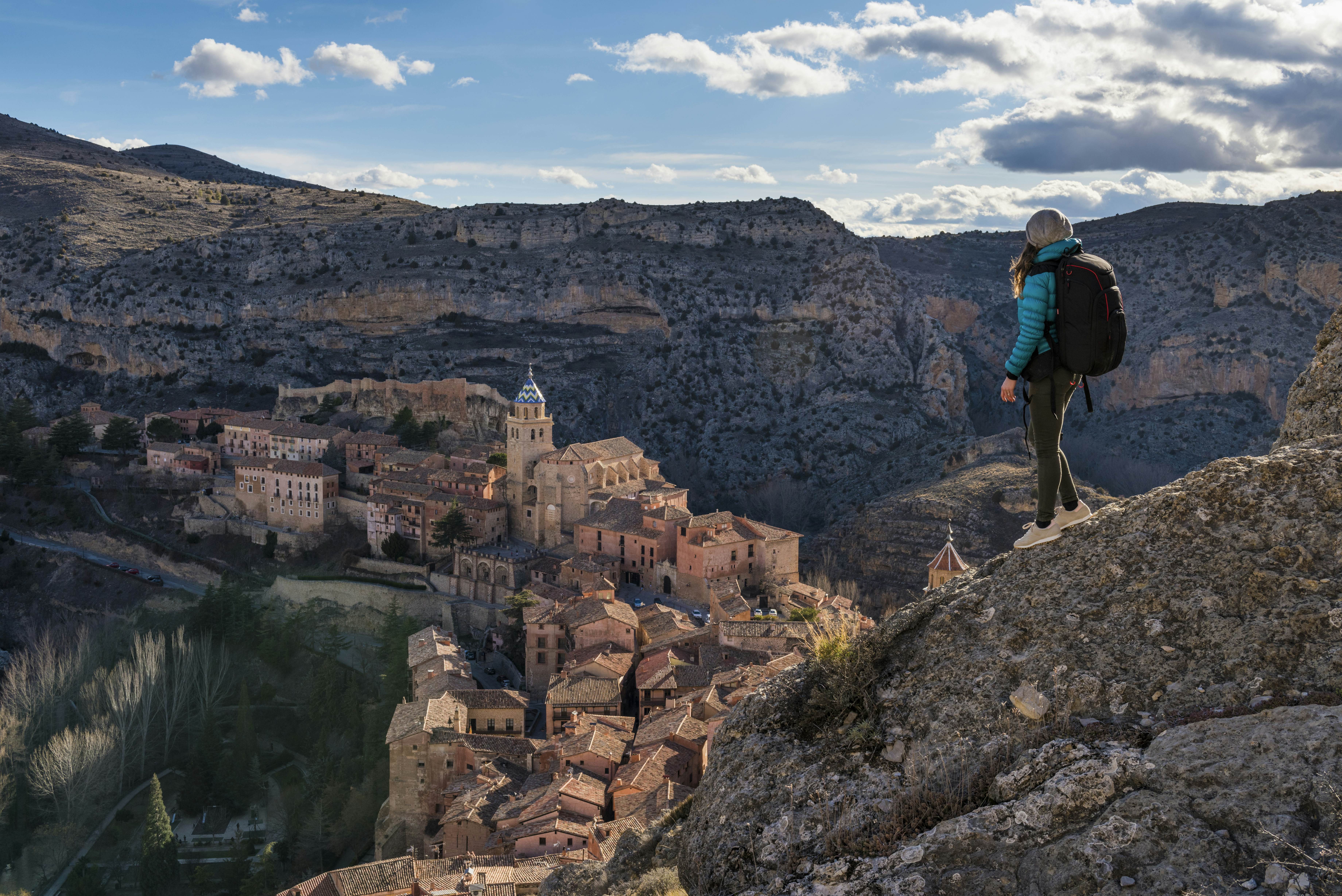 A hiker admires the view of Albarracin. Albarracin, Teruel, Aragon, Spain